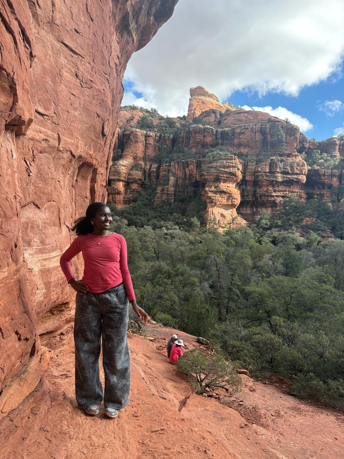 Zahrah hiking in a red-rock landscape